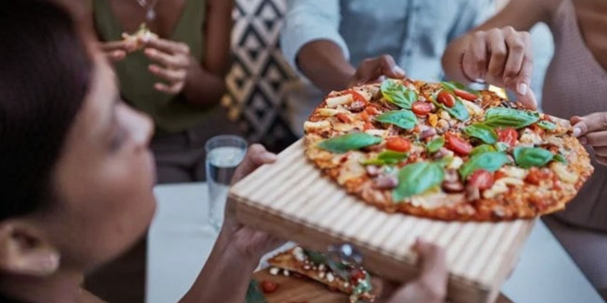 Fresh pizza made in a Pizza Oven Company outdoor gas pizza oven — shop now